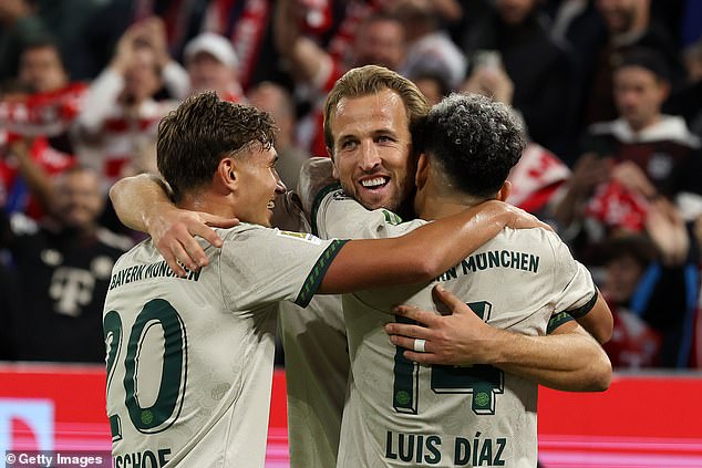 Harry Kane, pictured after scoring one of his two goals in a 4-0 win over Hoffenheim on Friday, insists he is happy at Bayern Munich