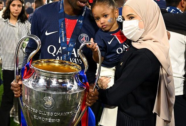 Ousmane Dembele is pictured with his wife Rima Edbouche and their young daughter after the Frenchman helped PSG to the Champions League last season