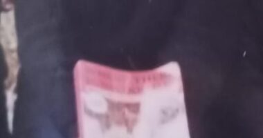 Peninah said that being 'cut' was something that 'all girls' in her community 'were required to go through'. Above: A young Peninah holding a book