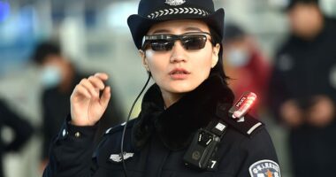 This photo taken on February 5, 2018 shows a police officer wearing a pair of smartglasses with a facial recognition system at Zhengzhou East Railway Station in Zhengzhou in China's central Henan province