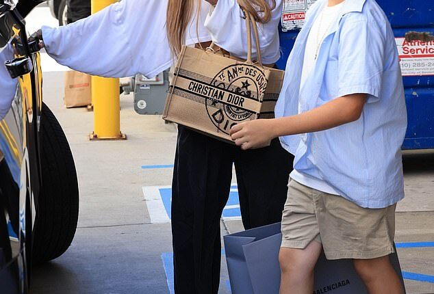 Jennifer Lopez, 56, continued to be a devoted stepmother to Ben Affleck's son Samuel, 13, as the pair enjoyed a luxurious shopping trip together over the weekend on Saturday