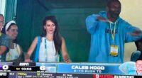 Hudson made her first appearance Monday as ESPN cameras caught her alongside Randy Moss, one of Belichick's favorite former players, after the Tar Heels scored on the opening drive to go up 6-0 on Texas Christian (TCU)