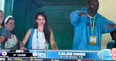 Hudson made her first appearance Monday as ESPN cameras caught her alongside Randy Moss, one of Belichick's favorite former players, after the Tar Heels scored on the opening drive to go up 6-0 on Texas Christian (TCU)
