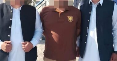 Questions have been raised over Birmingham councillor Saqib Khan's suitability for office after he was pictured at the wedding of his fugitive brother in Pakistan (right)