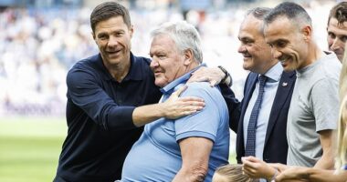 Xabi Alonso (left) gave mentor Josh Toshack (middle) a hug during a rare public appearance