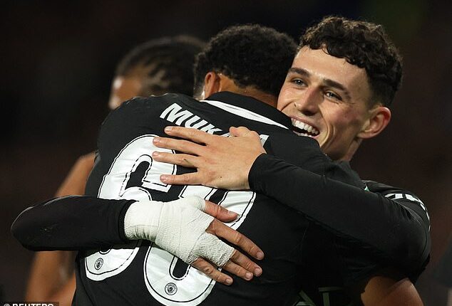 Phil Foden scored a fine opening Manchester City goal as they beat Huddersfield 2-0