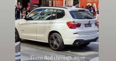 An allegedly stolen SUV driven by a gang reportedly armed with machetes has been chased by police through Melbourne's busy Bourke St mall on Monday lunchtime. Shoppers fled in terror as the white BMW sped through the pedestrianised shopping street where six people were killed and 27 seriously injured in 2017 by a drug-crazed driver.