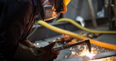 Concerns have been raised defence firms were being held back by the 'social value model' when bidding for military projects. Pictured: A combat ship is built at BAE Systems Govan in Glasgow, Scotland, in 2019
