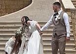 Moment wedding day takes a turn for the worse as bridesmaid slips down stairs before taking the bride with her