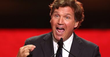 US political commentator Tucker Carlson speaks during the public memorial service for right-wing activist Charlie Kirk at State Farm Stadium in Glendale, Arizona, on September 21, 2025