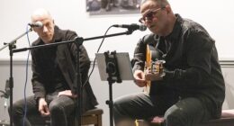 Dumbarton owner Mario Lapointe, above right, entertains fans in Bar72 at the Marbill Coaches Stadium while local musician Richie Gallacher listens in