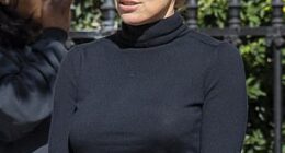 Pamela Anderson, 58, ditches her trademark blonde locks and debuts bold new look while strolling through a park in Paris on Tuesday, amid Fashion Week