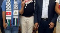 Grinning as he gives a Churchillian 'victory' sign, Wael Nawar, the spokesman for Greta Thunberg's Gaza 'freedom flotilla' poses with Youssef Hamdan, who runs Hamas' North African operation, during a meeting at its Algerian headquarters in June