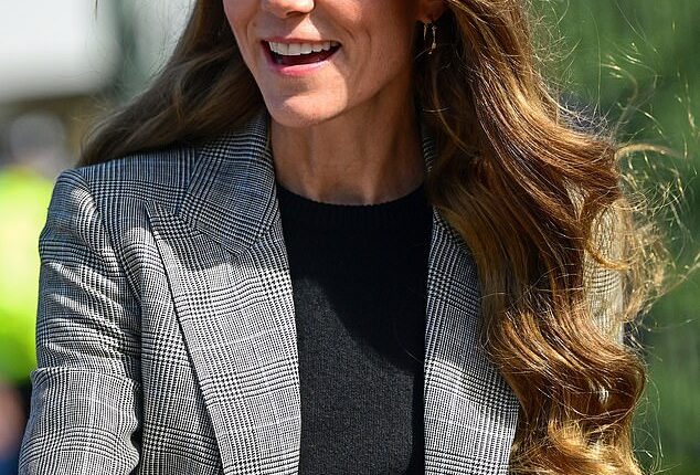 Kate was the image of elegance in a fitted suit with what is understood to be a Prince of Wales print