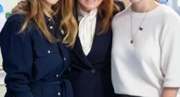 Princesses Beatrice and Eugenie have been left in a 'very difficult' position over their upcoming Christmas plans, a royal author has claimed. Pictured, the sisters with their mother, Sarah Ferguson, in London in April 2025