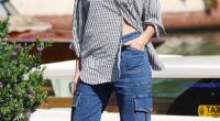 Rebecca Ferguson looked stylish in a casual striped shirt as she left Venice Film Festival alongside Idris Elba in old worn-torn T-shirt and Amanda Seyfried on Wednesday