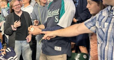A baseball fan has gone viral for the right reasons after giving a historic home run ball to a child