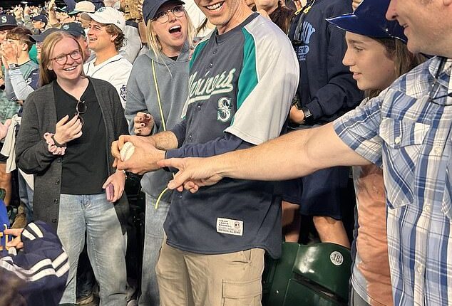 A baseball fan has gone viral for the right reasons after giving a historic home run ball to a child