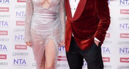 Rob Rinder didn't know where to look on Wednesday as he graced the red carpet at London 's O2 Arena with a very busty Elizabeth Hurley ahead of the 2025 National TV Awards