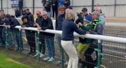 Robbie Savage gave Forest Green Rovers fans a glimpse of his softer side as he carried a young supporter onto the pitch