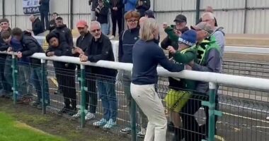 Robbie Savage gave Forest Green Rovers fans a glimpse of his softer side as he carried a young supporter onto the pitch