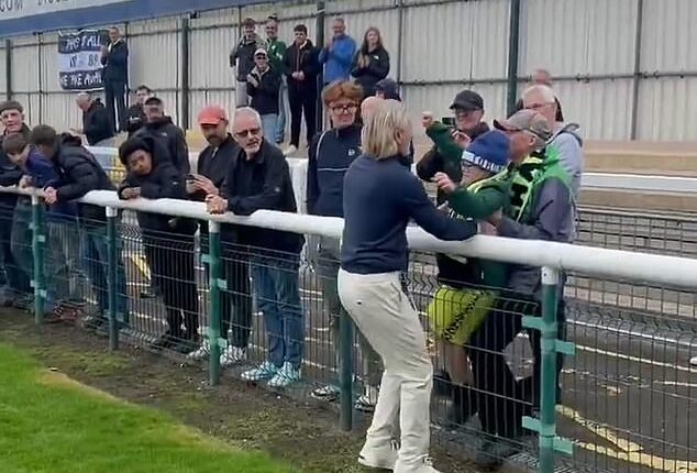 Robbie Savage gave Forest Green Rovers fans a glimpse of his softer side as he carried a young supporter onto the pitch