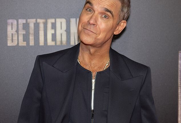 Robbie Williams has reportedly delayed the release of his Britpop album to avoid clashing with Taylor Swift (Robbie seen in December)