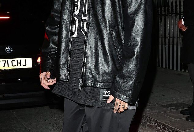 Romeo Beckham cut a trendy figure in a black leather jacket as he celebrated his 23rd birthday with family at the lavish London venue Aki on Friday