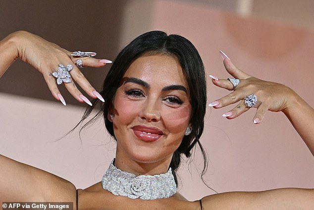 Cristiano Ronaldo's fiancée Georgina Rodriguez flashed her giant sparkling engagement ring on Sunday as she hit the red carpet at the Filming Italy Venice Award