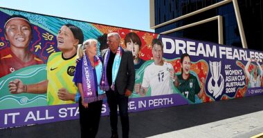 Sam Kerr's parents Roxanne and Roger (pictured in front of a mural featuring their daughter in Perth) feared for her future in football as her battle with a knee injury dragged on