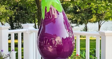 The shiny purple eggplant sculpture in front of Wine Bin was granted a 12-month reprieve but faces removal next year