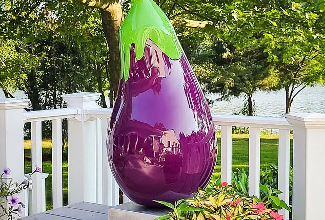 The shiny purple eggplant sculpture in front of Wine Bin was granted a 12-month reprieve but faces removal next year