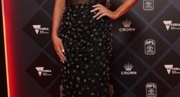 Easily one of the night's standout looks, Monique Cripps (wife of the Blues' Patrick Cripps) was flawless in a custom bedazzled black gown topped with an effortlessly chic neck scarf