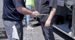 South Korea 's foreign minister may visit the United States to respond to a raid on a Huyndai plant in Georgia that detained 475 people, most of them South Korean nationals, with photos showing some of those arrested being put in chains