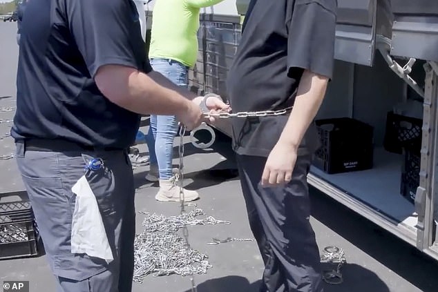 South Korea 's foreign minister may visit the United States to respond to a raid on a Huyndai plant in Georgia that detained 475 people, most of them South Korean nationals, with photos showing some of those arrested being put in chains
