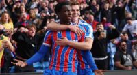 Eddie Nketiah (left) celebrates his last-minute winner against Liverpool with Justin Devenny