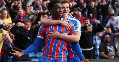 Eddie Nketiah (left) celebrates his last-minute winner against Liverpool with Justin Devenny