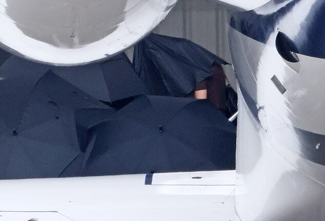 Taylor Swift seen arriving in Santa Barbara for Selena Gomez's big day. The singer was photographed in a black short sleeve top and carrying a black bag as she was carefully led out of her private plane this afternoon