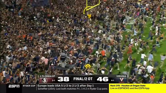 Thousands of college football fans were seen storming onto the field on Friday night