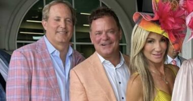 With her then-husband Troy Duhon standing between them, Tracy Duhon (right) and Texas Attorney General Ken Paxton (left) pose for a photo at the Kentucky Derby in May 2024