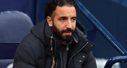 Manchester United boss Ruben Amorim looks on in despair during his side's humiliating 3-0 loss to Manchester City