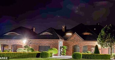 The Daily Mail can reveal Piotr Szczerek lives in a luxurious modern villa in a small upmarket enclave in a historical village in Poland, with his wife Anne and their two sons aged 10 and 12