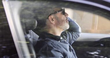 He was spotted for the first time in public on Thursday afternoon, wearing black sunglasses and a navy button down in the drivers seat of his Audi