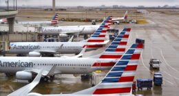 Dallas has been forced to close both of its airports on Friday until at least 5pm CT due to equipment issues. Pictured are American Airlines passenger jets at Dallas/Fort Worth International Airport