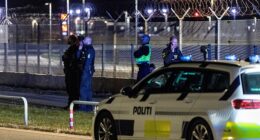 Police officers seen at Copenhagen Airport after all flights were diverted due to drone sightings