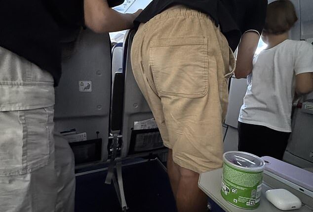 A traveller has vented her frustration over an 'infuriating' problem on a flight after she paid extra money for legroom on a plane. Moments after take-off, a dad and his two kids decided to gather around the emergency door window, which was situated next to the trio