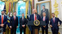 President Trump is pictured alongside, from left, Vice-President JD Vance, HHS secretary senior advisor Chris Klomp, Pfizer chief executive Albert Bourla, CMS administrator Dr Mehmet Oz and FDA commissioner Dr Marty Makary