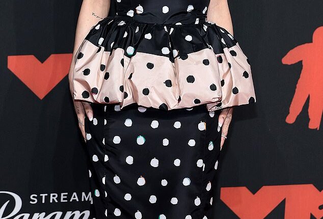 Ariana Grande led the worst dressed list at the 2025 VMAs in a strapless black and white polka dot frock that had a strange puffy ruffle in the center and hung awkwardly on her frame