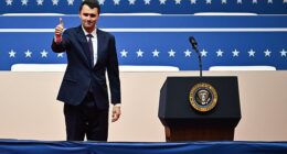 US media personality Charlie Kirk gave a thumbs up as he arrived to speak during the presidential inaugural parade inside Capitol One Arena, in Washington, DC