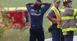A firefighter at the scene with his hands over his head as the incident unfolds in York County